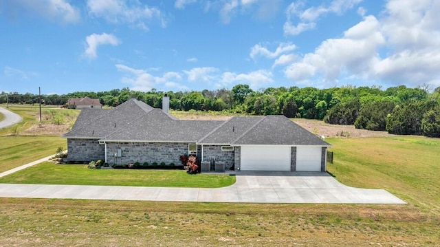 ranch-style house with a garage, a front lawn, a chimney, central AC unit, and concrete driveway