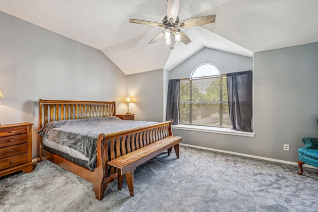 carpeted bedroom with a textured ceiling, ceiling fan, and lofted ceiling