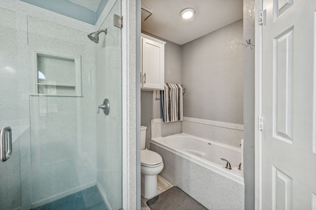 bathroom featuring toilet and independent shower and bath