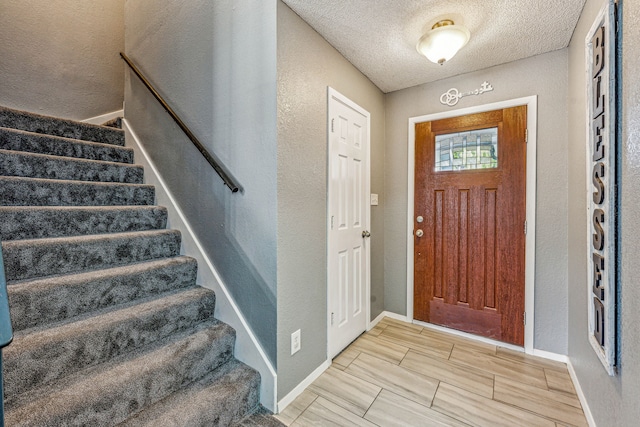 entrance foyer featuring a textured ceiling