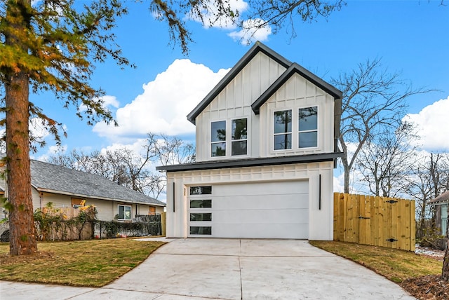 view of front of home with a front yard and a garage