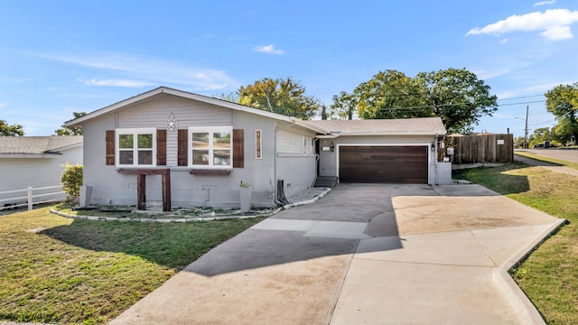 single story home with a garage and a front yard