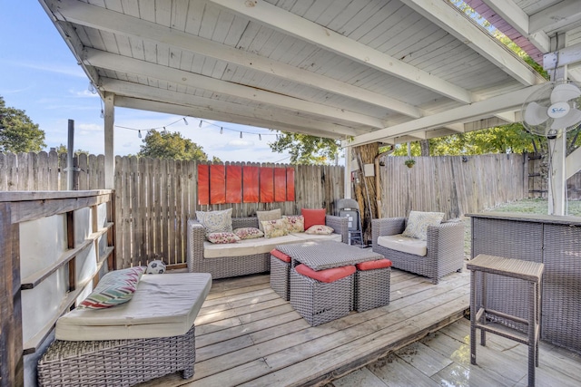 wooden terrace featuring an outdoor living space