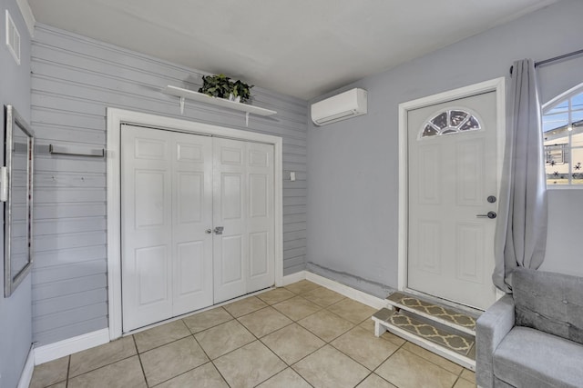 view of exterior entry with a wall unit AC