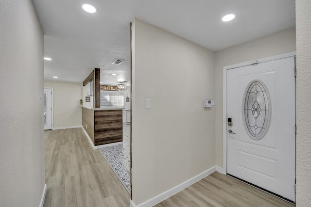 foyer entrance featuring light wood-type flooring