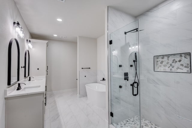 bathroom with vanity and independent shower and bath