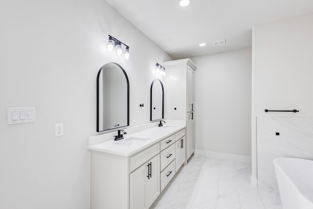 bathroom featuring vanity and a bathing tub