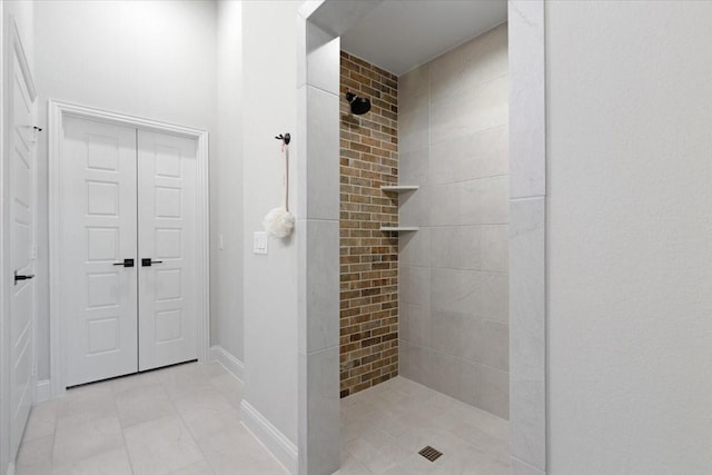 bathroom with tiled shower