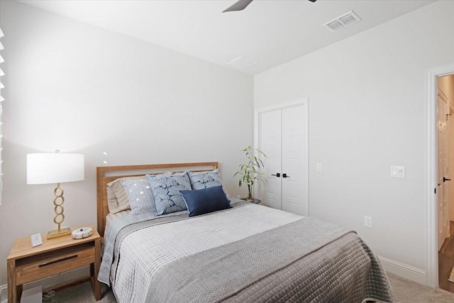 bedroom featuring carpet floors, a closet, and ceiling fan