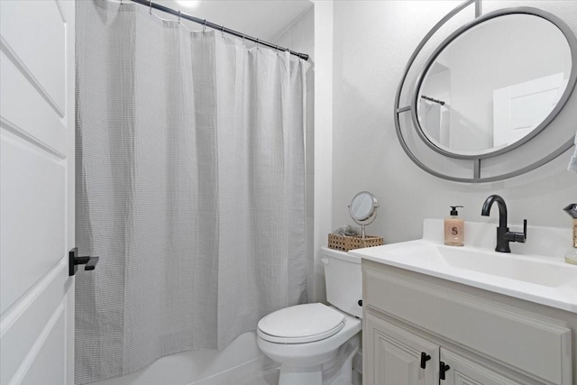 bathroom featuring vanity, toilet, and walk in shower