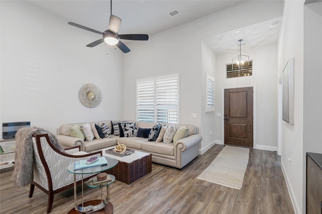 3941 Dalea Dr, Prosper, TX 75078 - living room with a towering ceiling, wood finished floors, baseboards, and ceiling fan