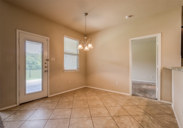 unfurnished dining area with light tile patterned flooring and a chandelier