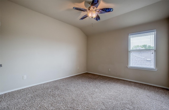 unfurnished room with carpet floors, vaulted ceiling, and ceiling fan