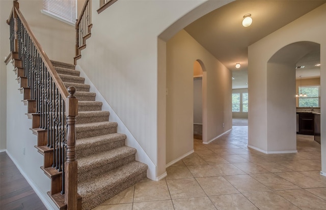 tiled foyer featuring sink