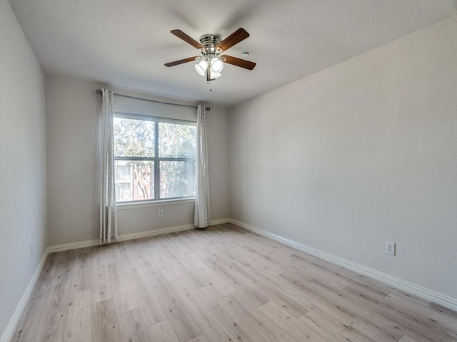 unfurnished room featuring ceiling fan and light hardwood / wood-style floors