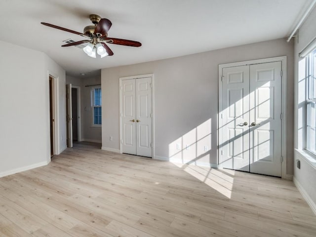 unfurnished room with ceiling fan and light wood-type flooring