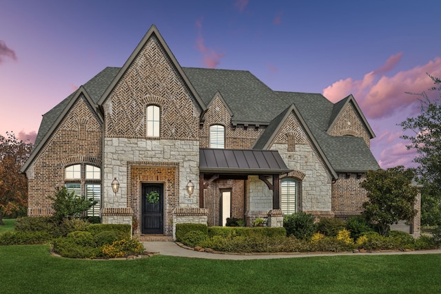 french provincial home featuring a yard