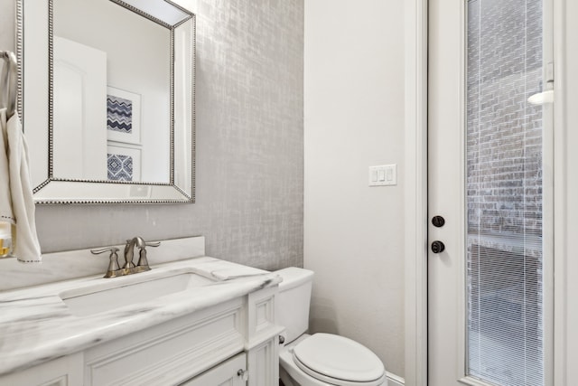 bathroom with vanity and toilet