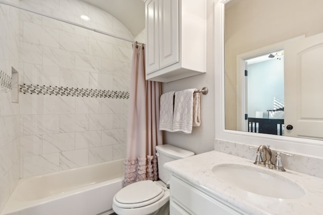 full bathroom with toilet, vanity, and shower / bathtub combination with curtain