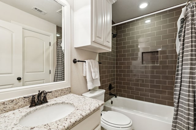 full bathroom featuring toilet, vanity, and shower / tub combo with curtain