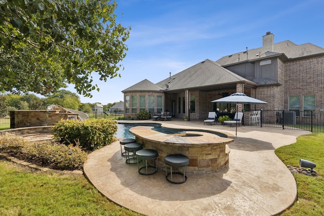 exterior space featuring a patio area and a pool