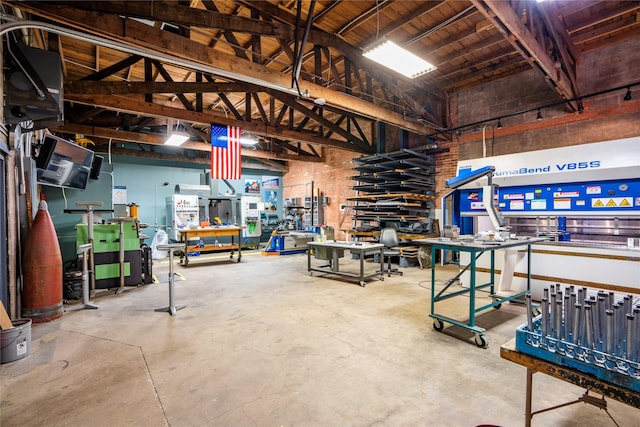 interior space with a workshop area and wood ceiling