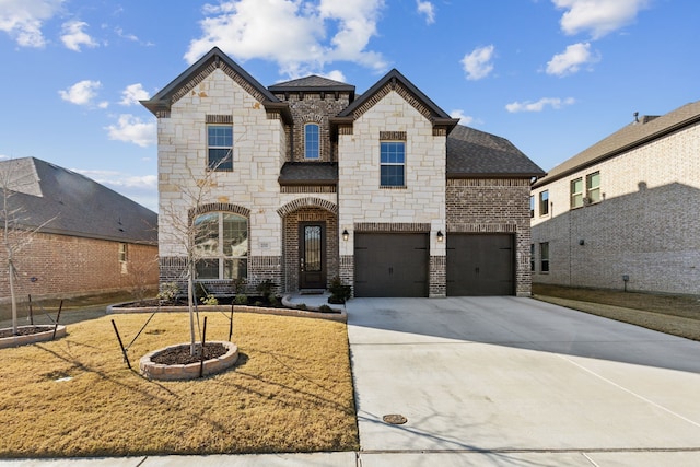 french country inspired facade featuring a garage