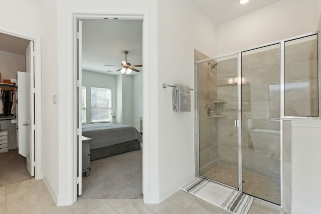 bathroom with walk in shower, tile patterned flooring, and ceiling fan