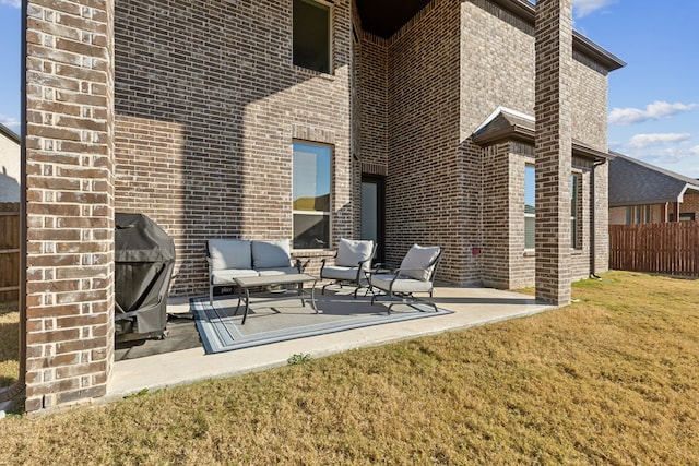 back of property with a patio, outdoor lounge area, and a lawn