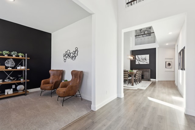 sitting room featuring light hardwood / wood-style floors