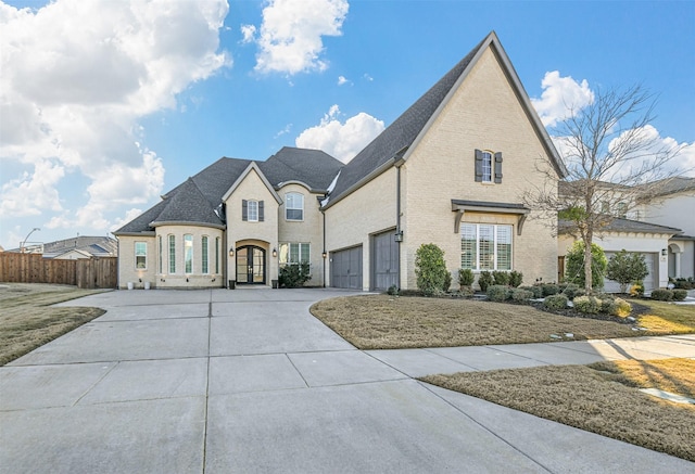 french country inspired facade with a garage