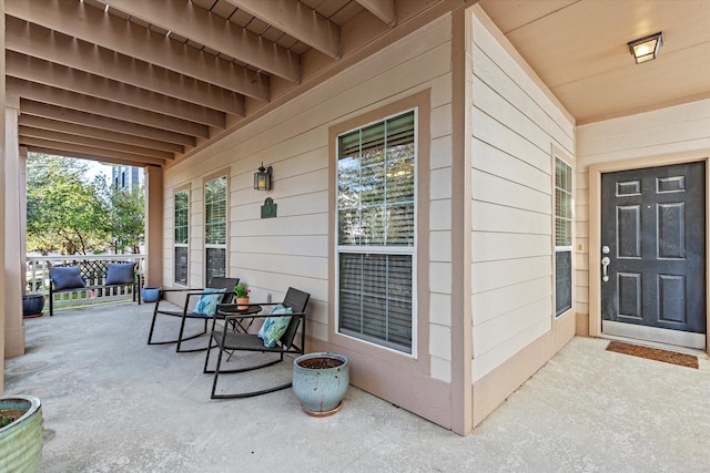 doorway to property featuring covered porch