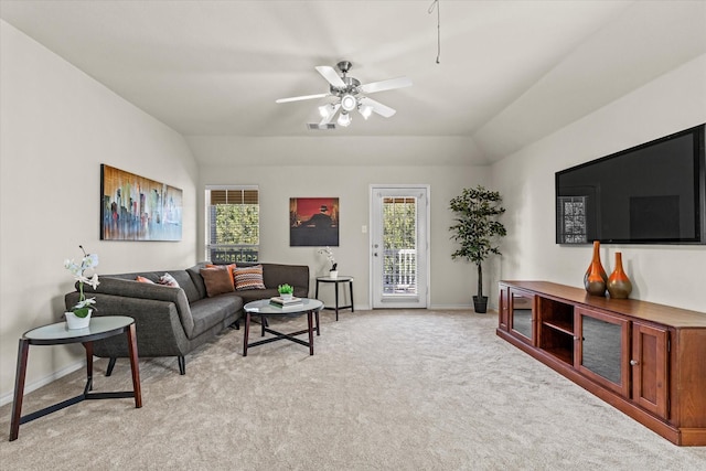 carpeted living room featuring vaulted ceiling, a wealth of natural light, and ceiling fan