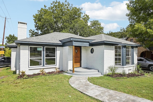 prairie-style house with a front yard