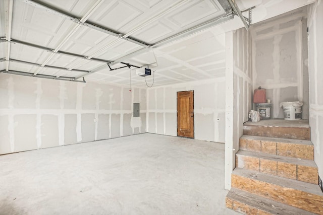 garage featuring electric panel and a garage door opener