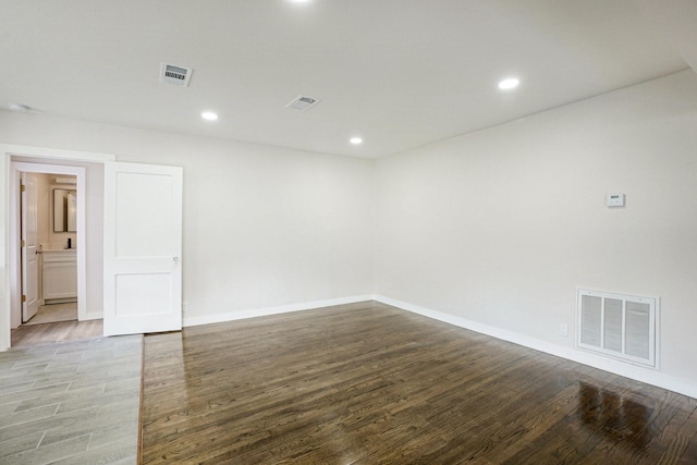 spare room with hardwood / wood-style flooring