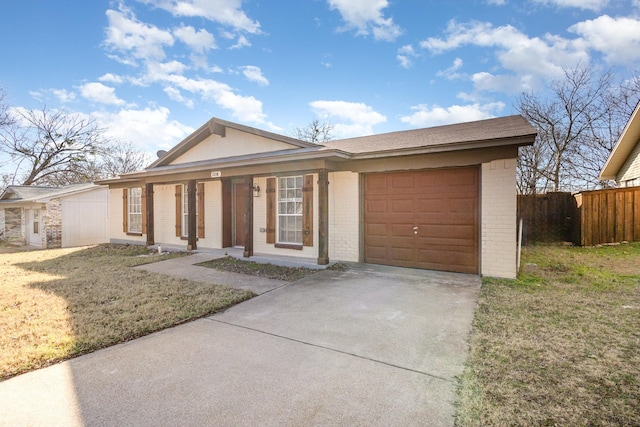 ranch-style house with a front yard and a garage