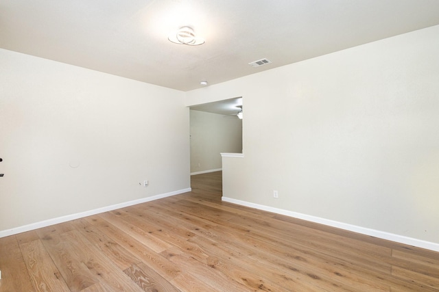 unfurnished room with light hardwood / wood-style floors