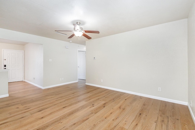 empty room with ceiling fan and light wood-type flooring