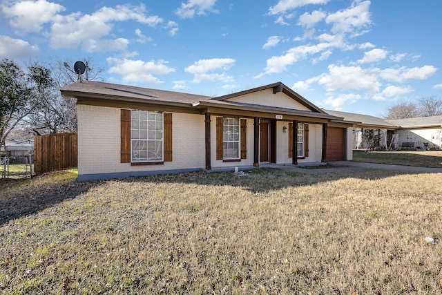 ranch-style house with a front lawn and a garage