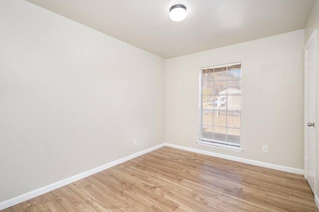 spare room featuring light wood-type flooring