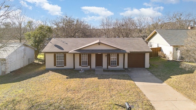 view of front of property featuring covered porch, a front yard, and a garage