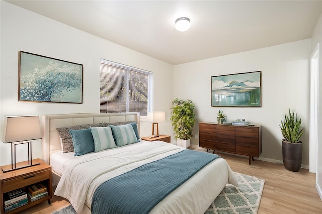 bedroom with light wood-type flooring