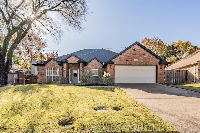 view of front of property with a front lawn and a garage