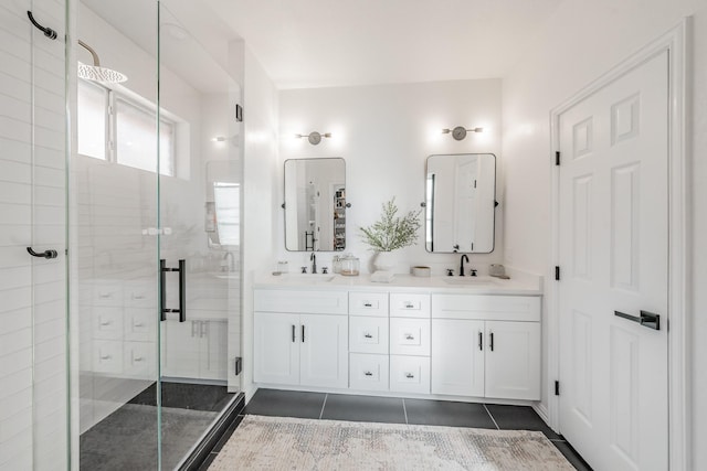 bathroom featuring tile patterned flooring, vanity, and a shower with door