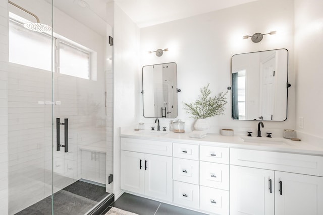 bathroom with tile patterned flooring, vanity, and an enclosed shower