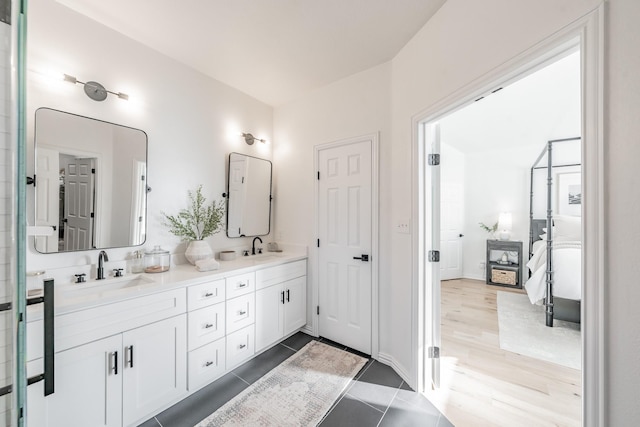 bathroom featuring tile patterned flooring and vanity