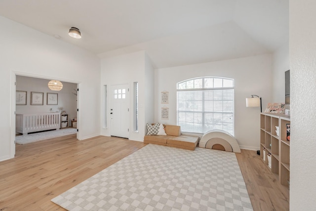 foyer featuring radiator heating unit and wood-type flooring