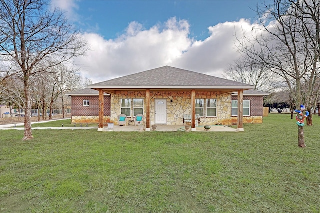 back of house featuring a patio area and a yard