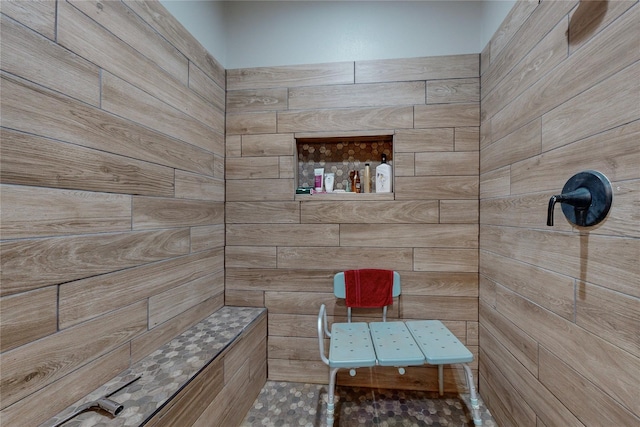 bathroom with a tile shower